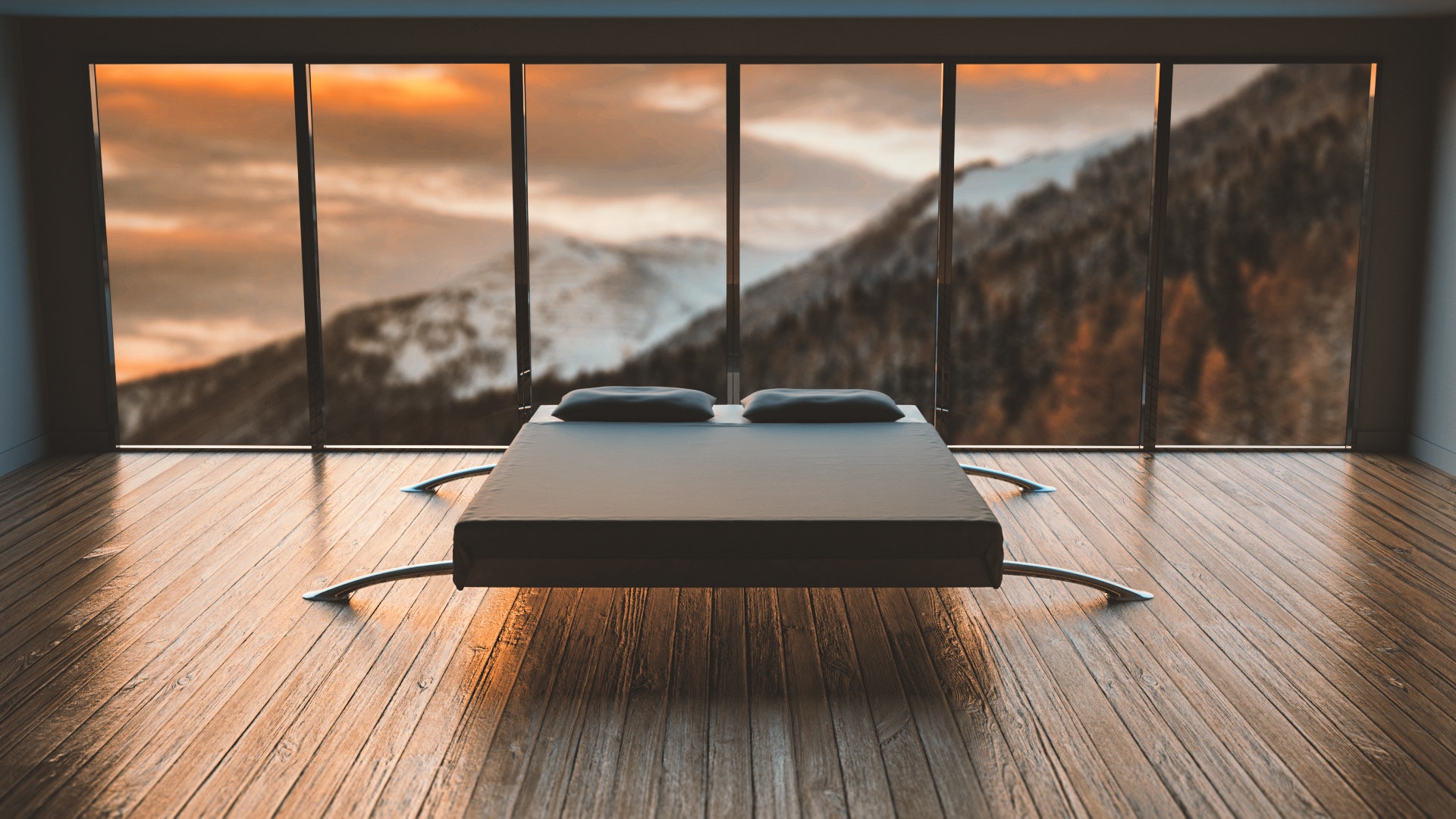 modern double bed overlooking snowcapped mountains through window